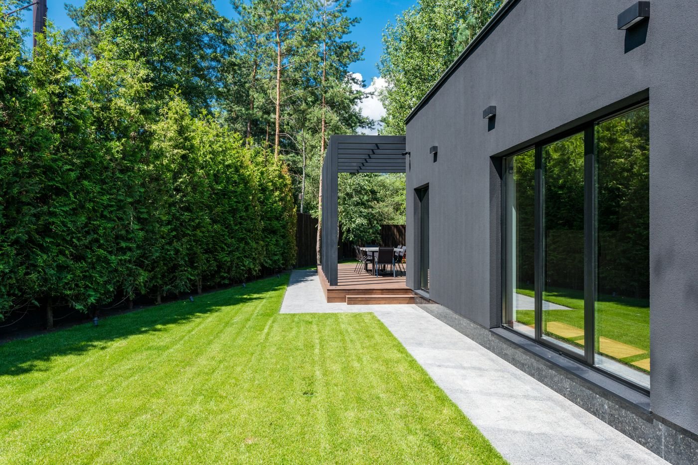 Refined modern home exterior and landscaped yard